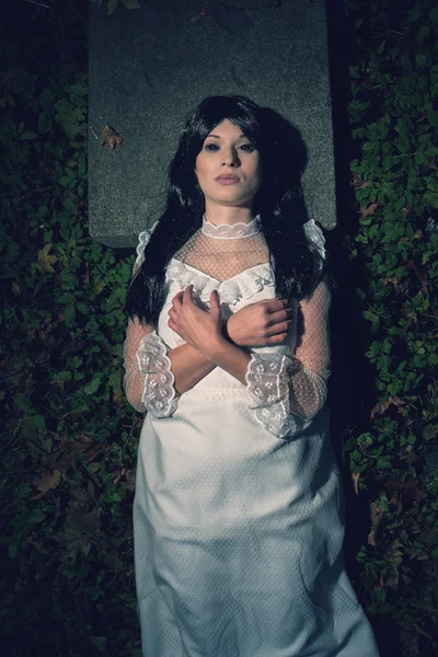 Witch from a crypt in the cemetery — Stock Photo, Image