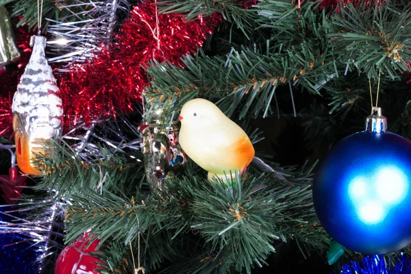 Toys on green christmas fir — Stock Photo, Image