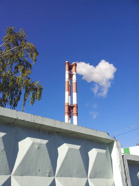 Smoke tube at sunny day — Stock Photo, Image