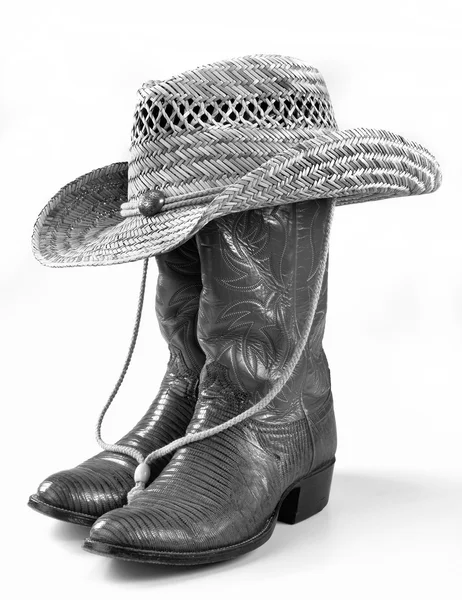 Cowboy stövlar och hatt.. Stockfoto