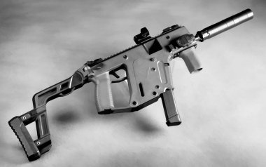 Modern 9mm foldable brief case auto gun with silencer/Suppressor. clipart