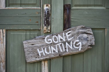 Gone hunting sign. clipart