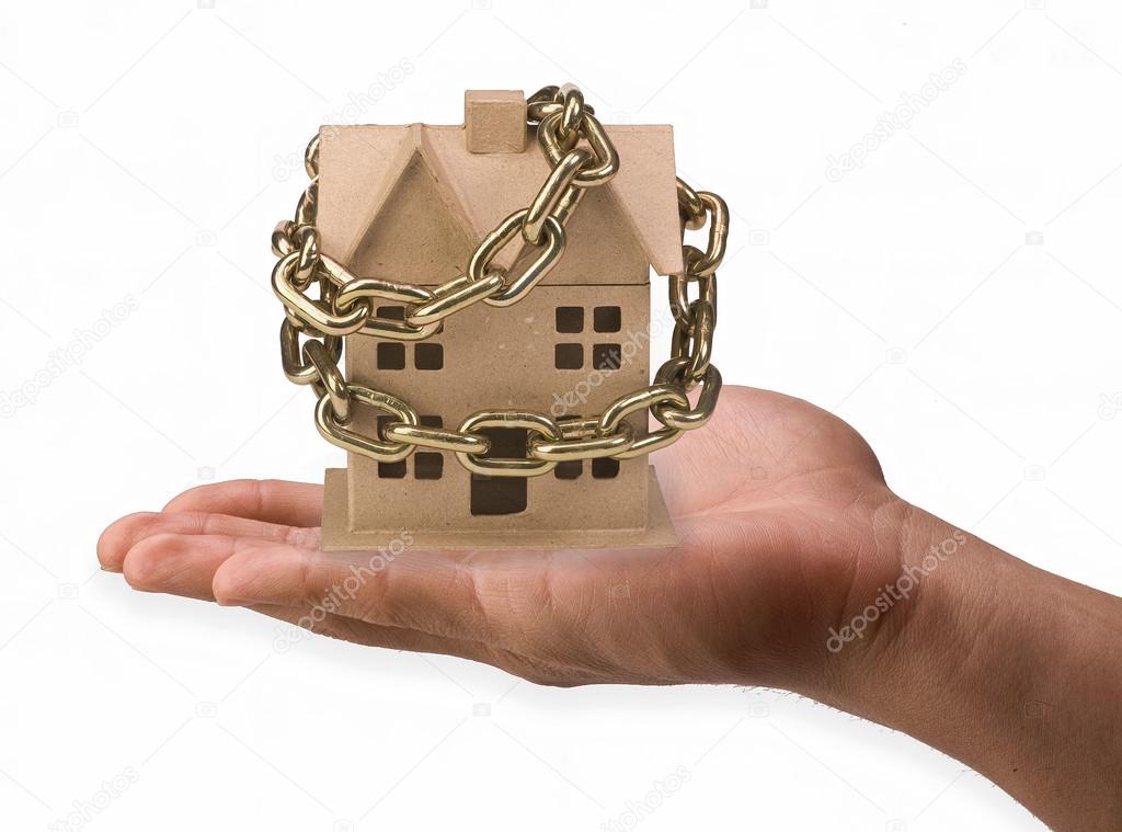 Home chained in hand.