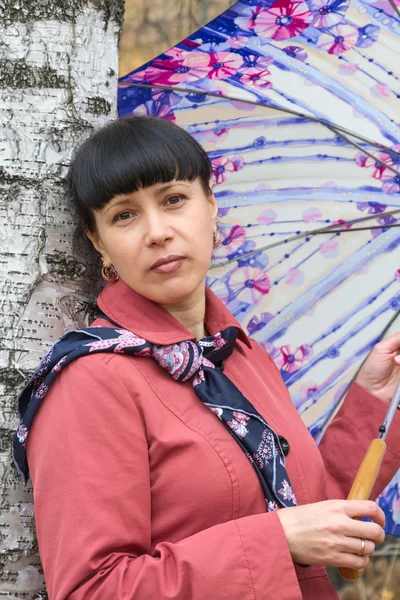 Mulher com um guarda-chuva — Fotografia de Stock