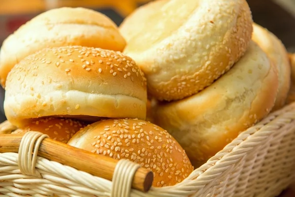 Some bread with seeds in the basket Royalty Free Stock Photos