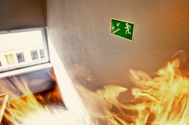 Fire in the builgding - evacuate building way clipart