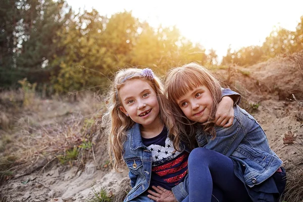 Joyful sisters playing in the park — Stock Photo, Image