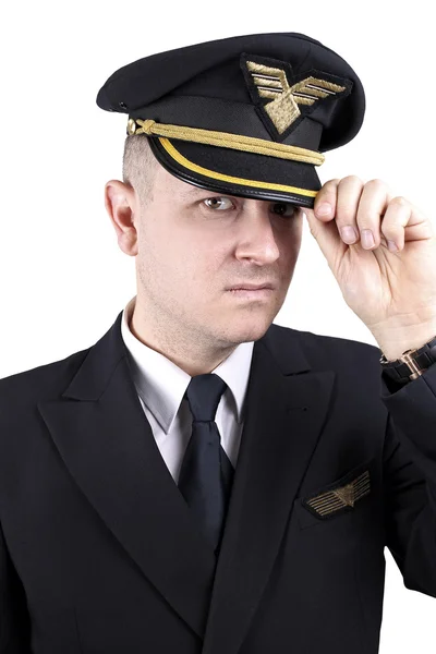 Jeune pilote sérieux en uniforme sur fond blanc — Photo