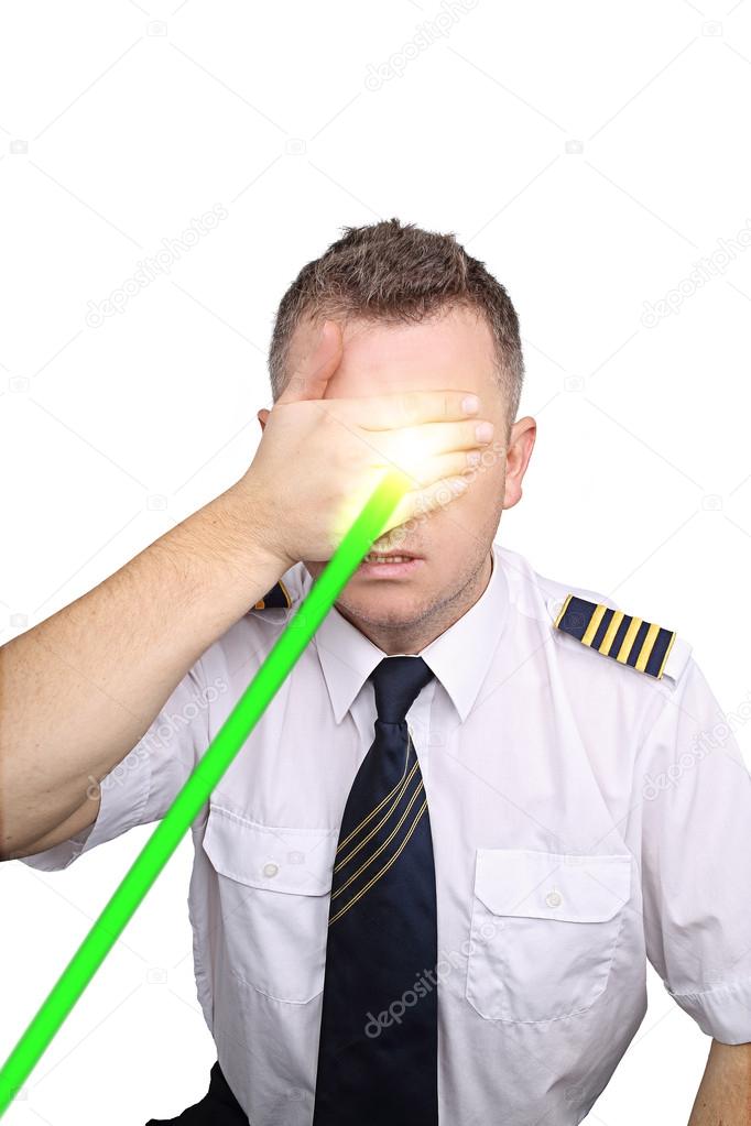 The pilot on a white background blinded by laser