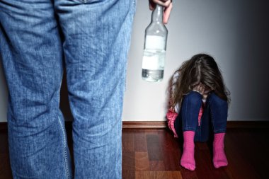 Drunk father standing over a crying daughter clipart