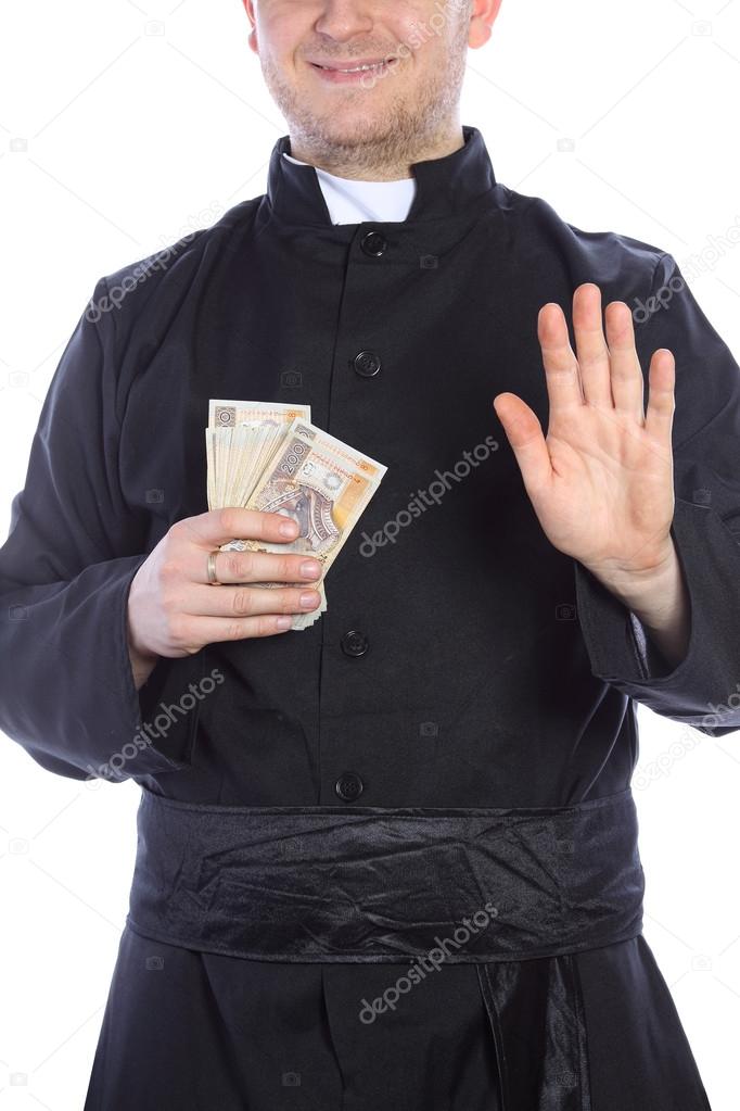The young priest holding a lot of money in hand