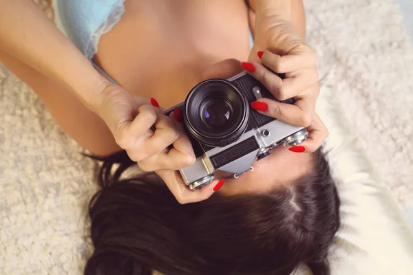 Girl in lingerie takes a photo — Stock Photo, Image