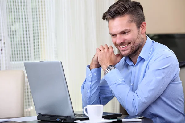 Young businessman checks mail on the computer Stock Picture