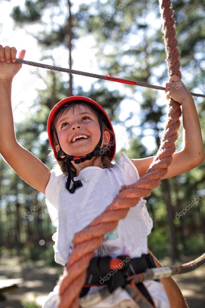 Young girl on the rope park