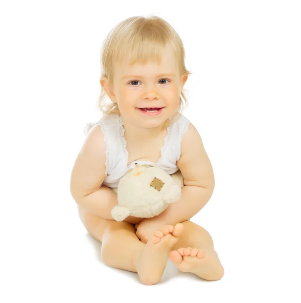 Маленький ребенок с игрушкой — стоковое фото