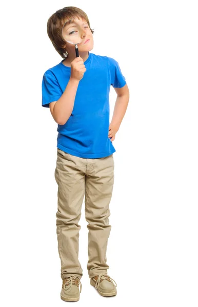 Little boy with magnifying glass — Stock Photo, Image