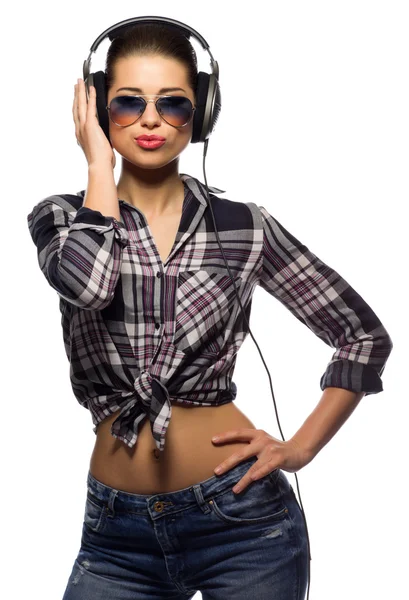 Young woman in jeans listen music — Stock Photo, Image
