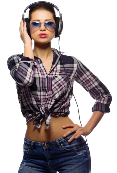 Young girl in blue jeans listen music — Stock Photo, Image