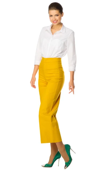 Young woman in yellow pants — Stock Photo, Image