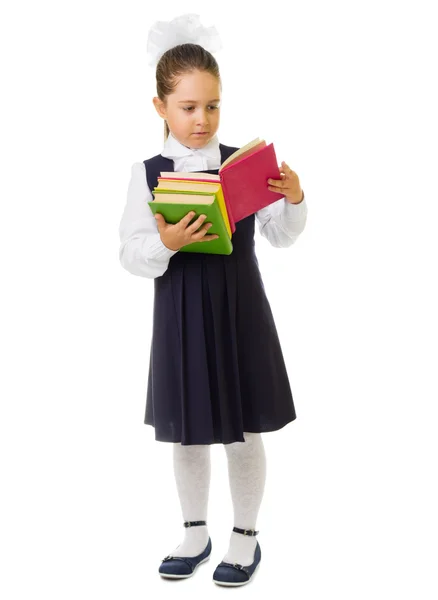 Malá školačka s knihami — Stock fotografie