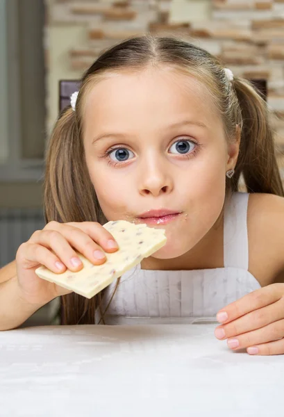 Little girl with chocolate — Stock Photo, Image