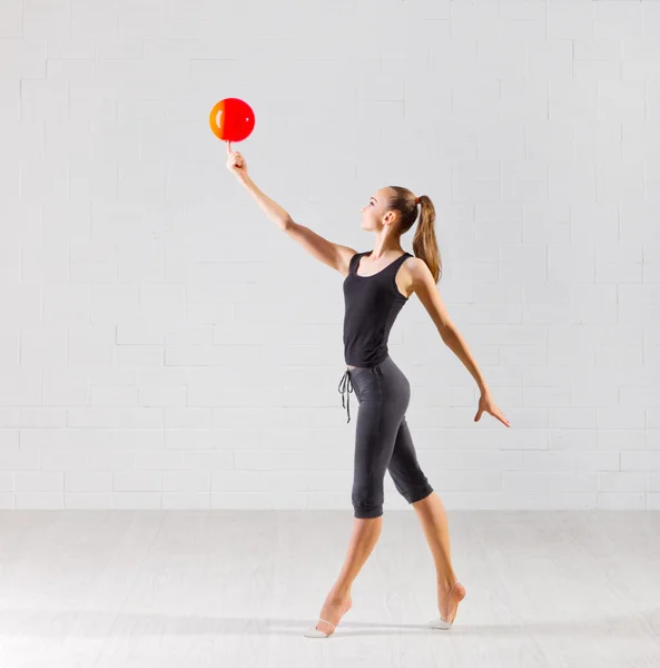 Girl is engaged in art gymnastics — Stock Photo, Image