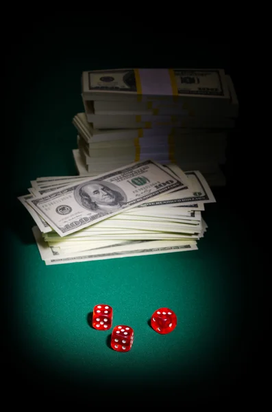 Stack of dollars and dices — Stock Photo, Image