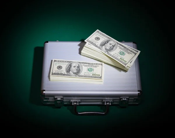 Dollars and metallic case — Stock Photo, Image