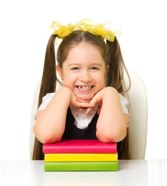 Schoolmeisje aan de tafel — Stockfoto