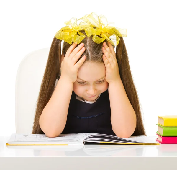 Schoolgirl at the table — Stock Photo, Image