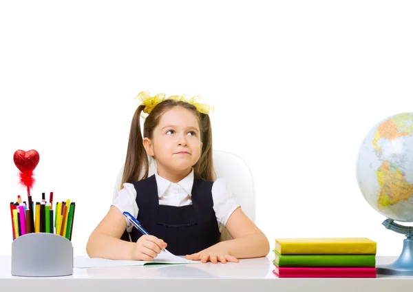 Schoolgirl at her desk — Stock Photo, Image