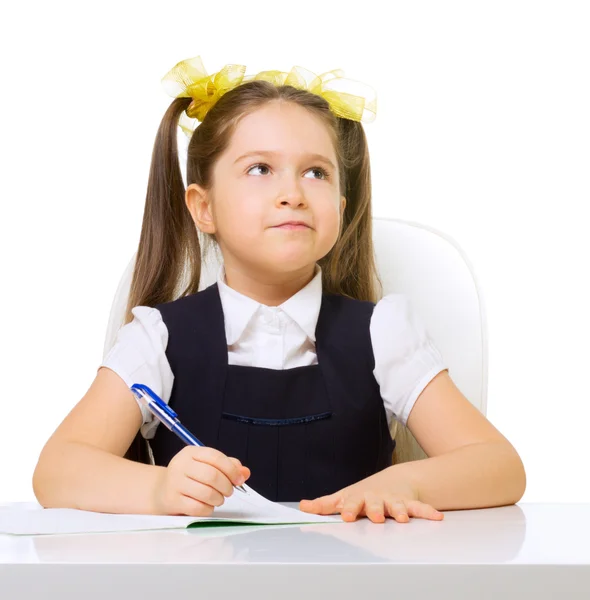 Schoolgirl at her desk — Stock Photo, Image