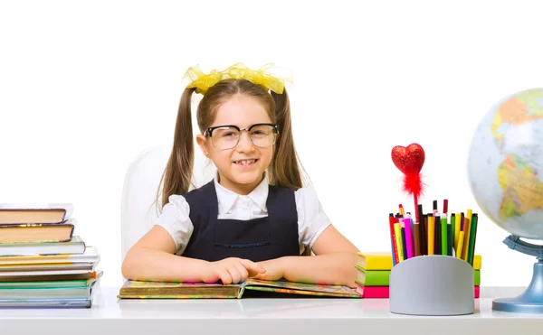 Schoolgirl at her desk — Stock Photo, Image