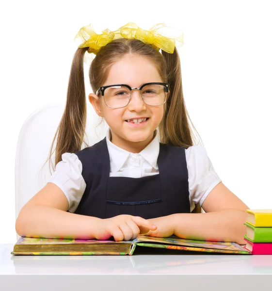 Schoolgirl at her desk — Stock Photo, Image