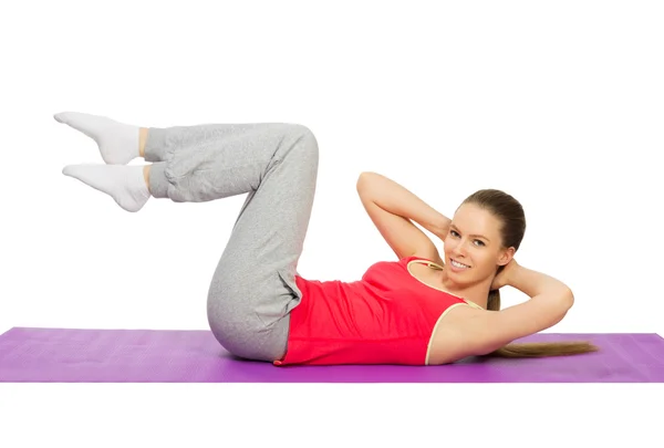 Young sporty girl doing gymnastic exercises Royalty Free Stock Photos