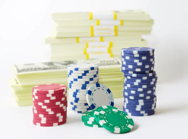Gambling chips dices and heap of dollars — Stock Photo, Image