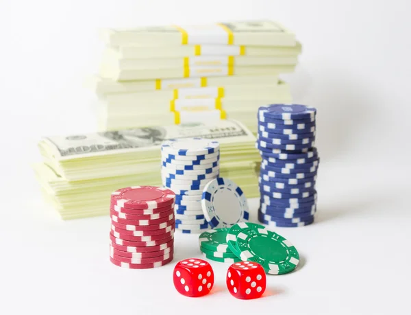 Gambling chips dices and heap of dollars Stock Image