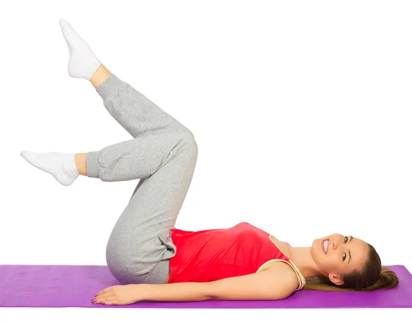 Young sporty girl doing gymnastic exercises Stock Picture