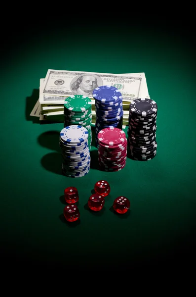 Gambling chips dollars and dices Royalty Free Stock Photos