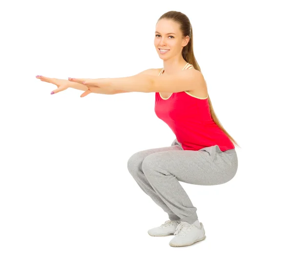 Chica deportiva haciendo ejercicios de gimnasia Imágenes de stock libres de derechos