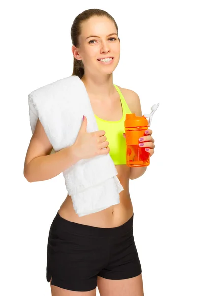 Young sporty girl with bottle and towel — Stock Photo, Image