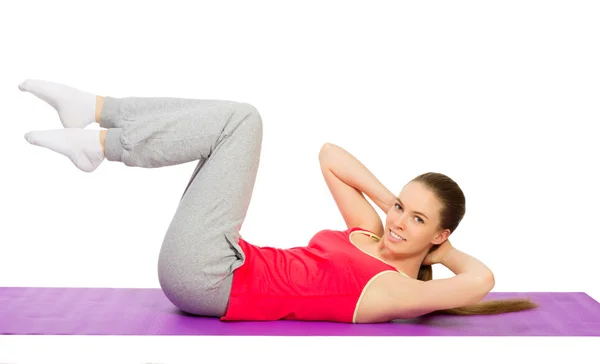 Ung sportig tjej gör gymnastiska övningar — Stockfoto