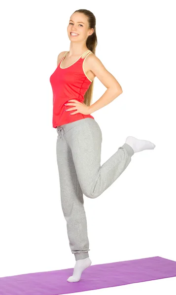 Sporty girl doing gymnastic exercises Stock Photo