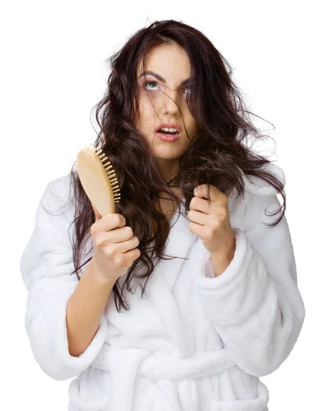 Displeased girl with haircomb — Stock Photo, Image