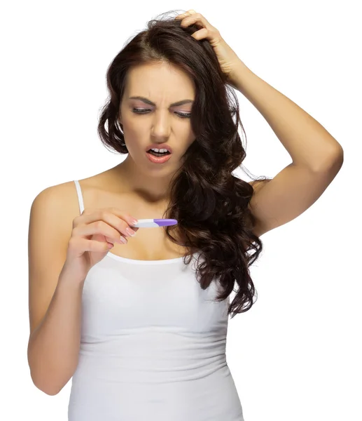 Displeased girl with pregnancy test — Stock Photo, Image