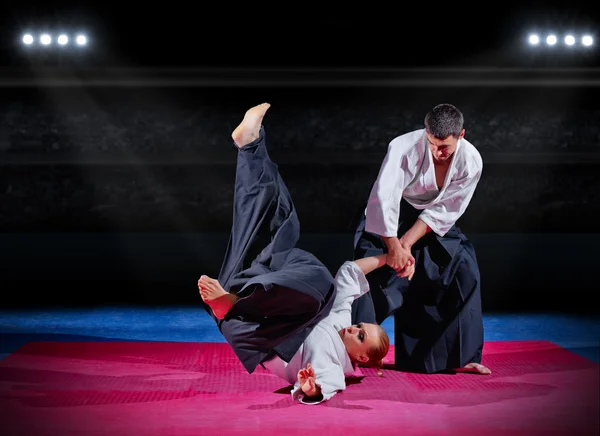 Fight between martial arts fighters at sports hall — Stock Photo, Image