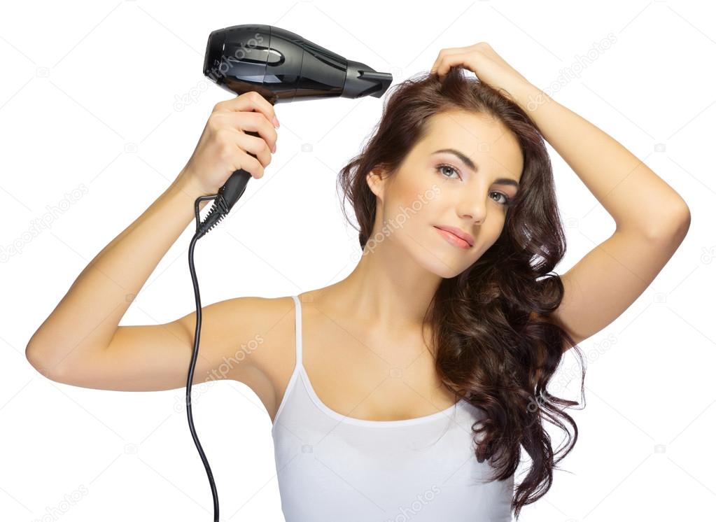 Young girl with hair dryer