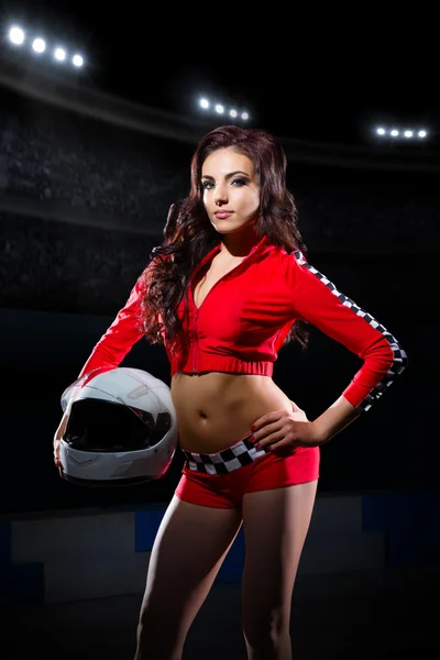 Young girl in red racing costume — Stock Photo, Image