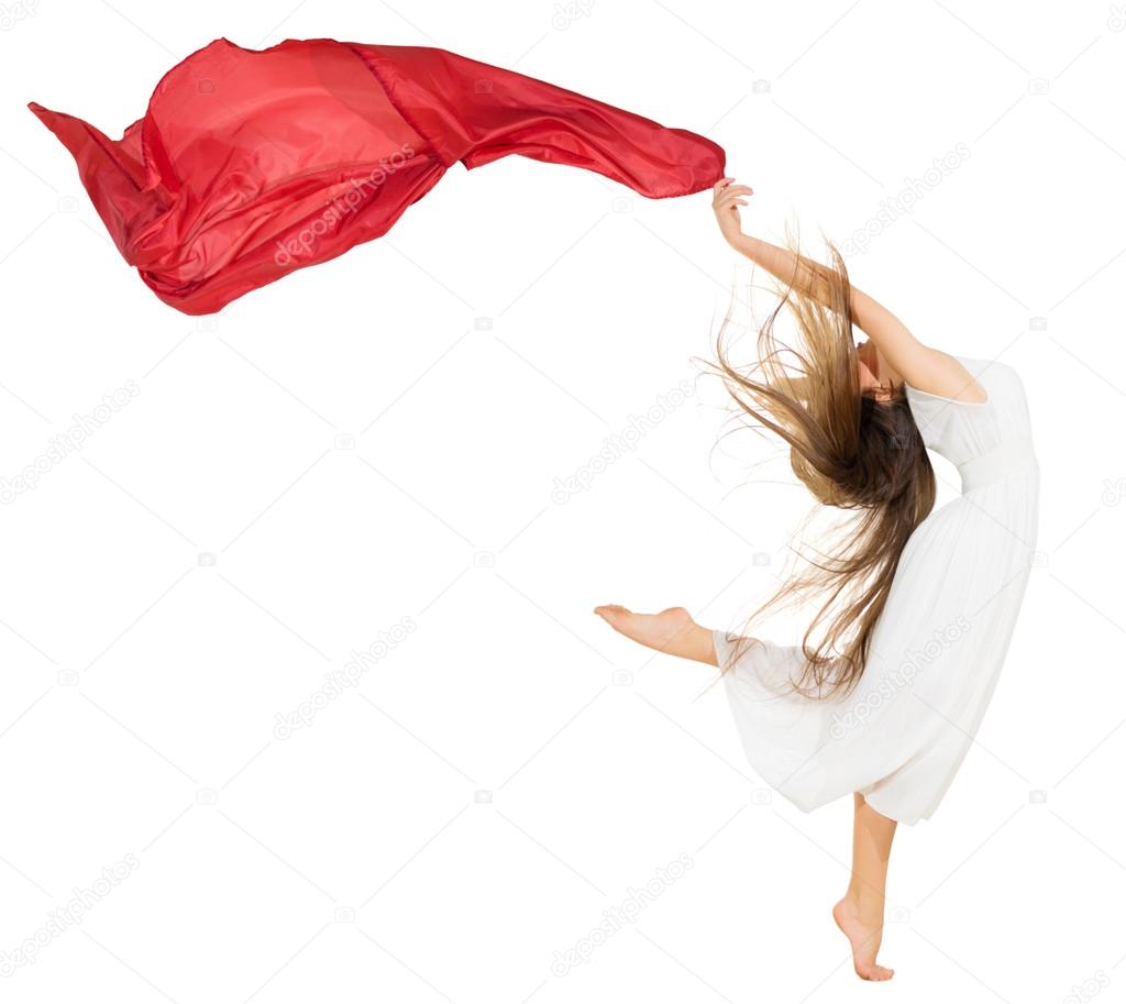 Young dancing girl in white dress