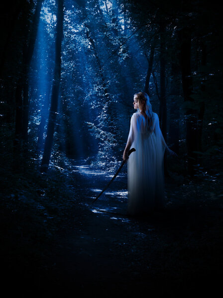 Young elven girl at night forest